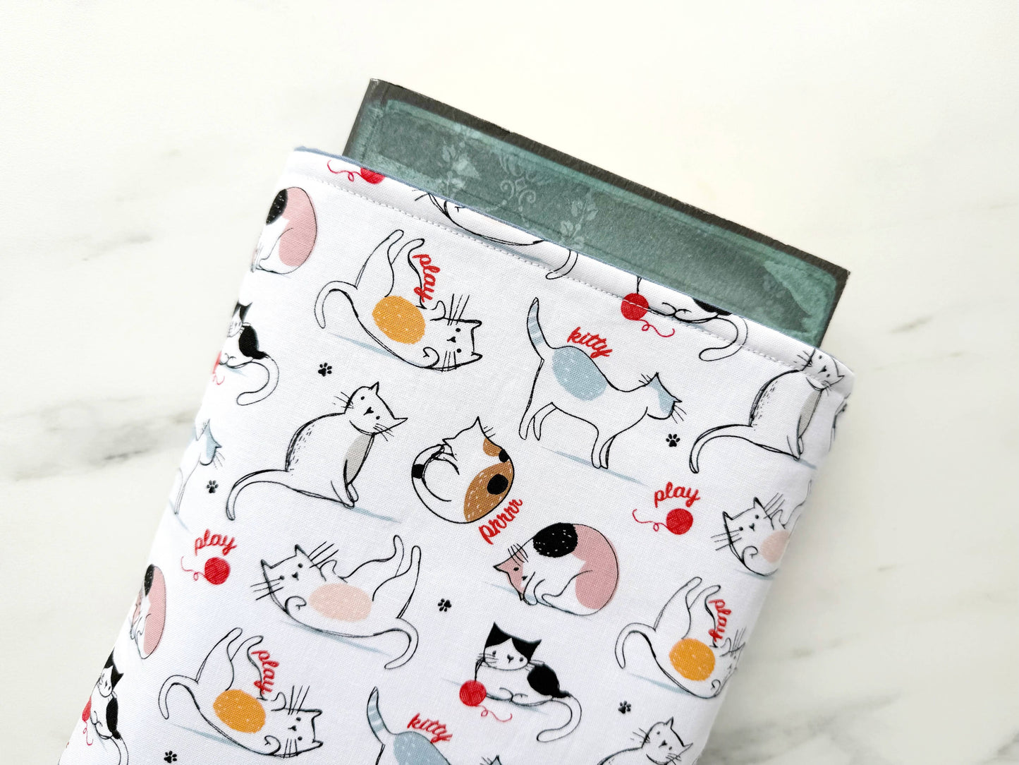 Cats play padded book sleeve