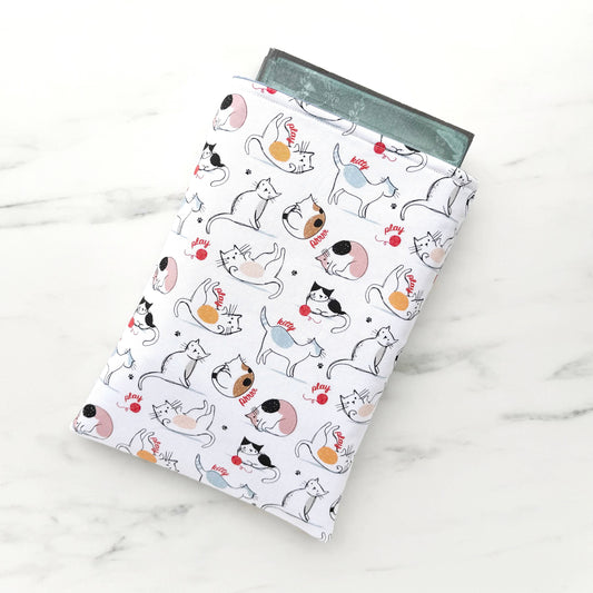 Cats play padded book sleeve