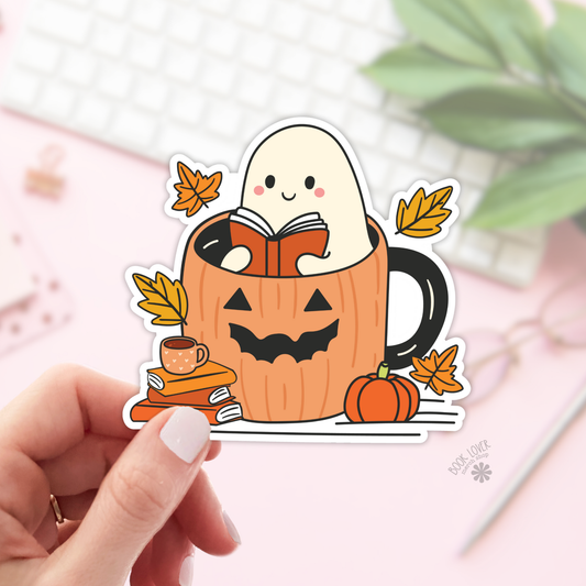 Ghost reading in a pumpkin mug sticker