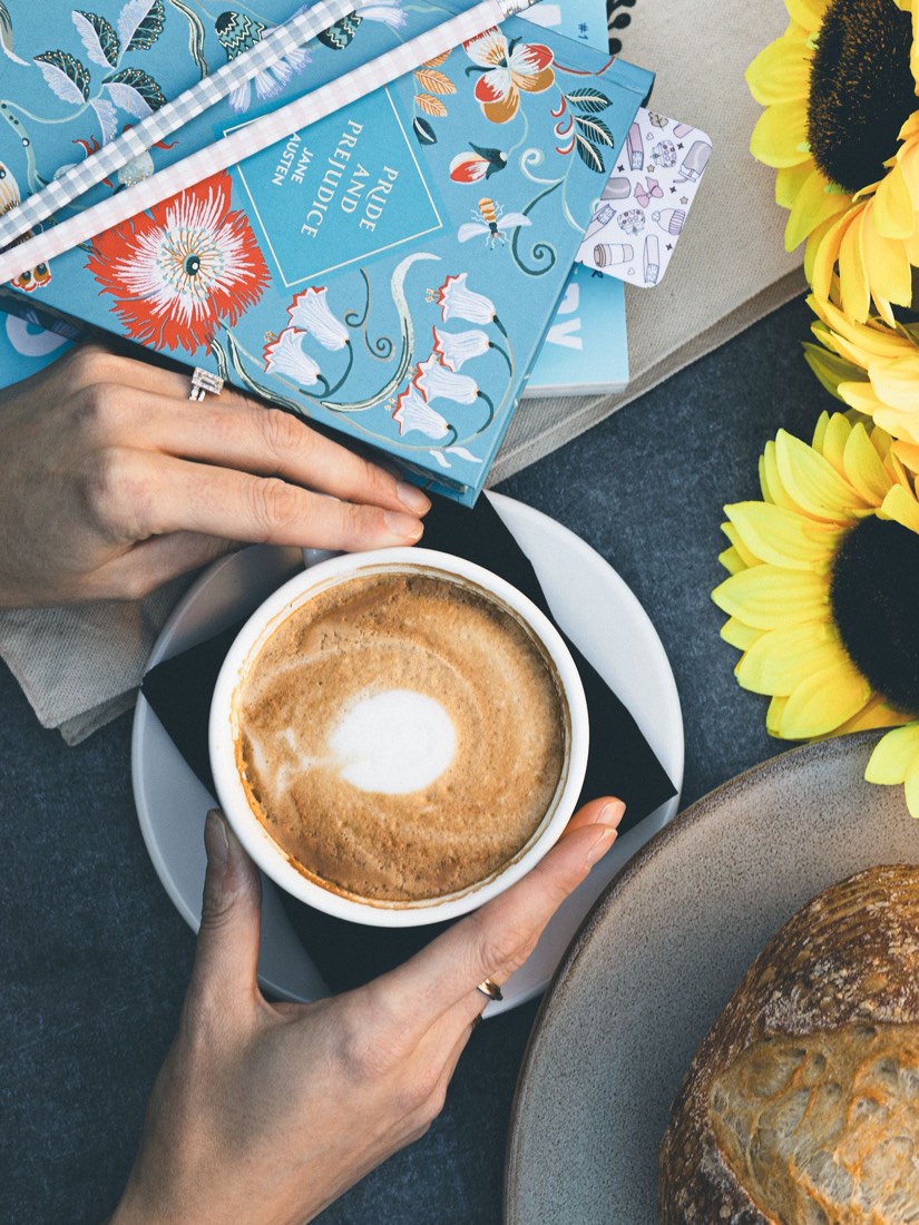 A stack of books and a latte at Nottawa Cottage Bookstore
